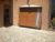 Photo réalisation Pose d&rsquo;une porte de garage électrique sur-mesure avec portillon et insert vitré décoratif à Tramoyes